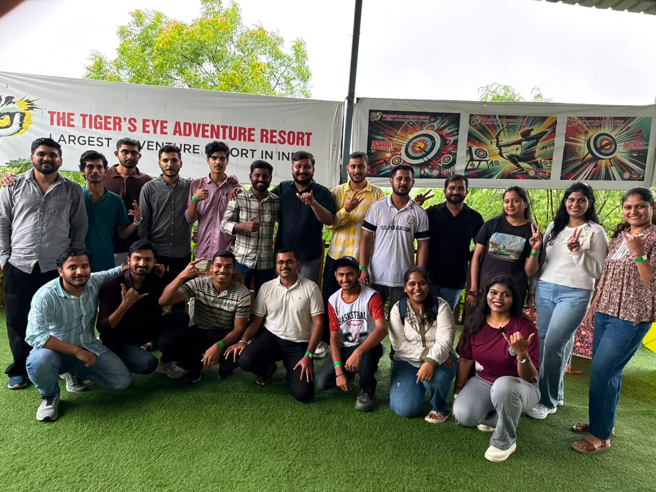 The team posing for a group photo at an adventure resort